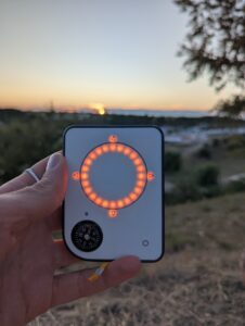 Person using a Buddycompass festival tracker at a music festival.