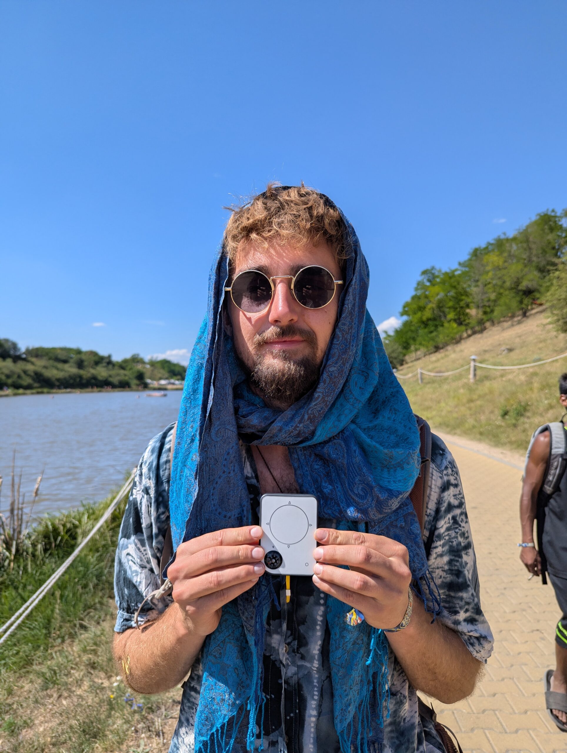 Person using a Buddycompass festival tracker at a music festival.