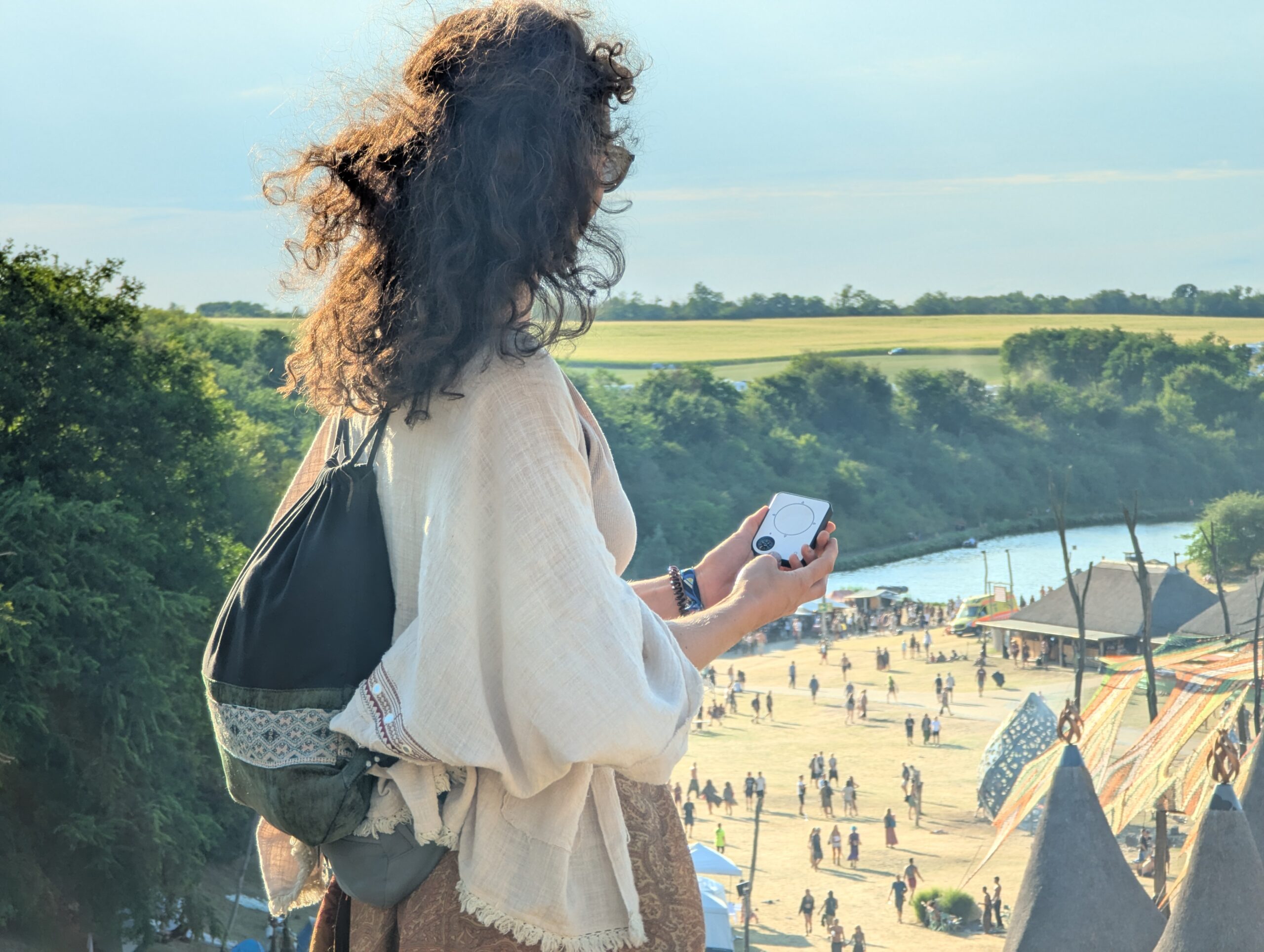 Person using a Buddycompass festival tracker at a music festival.