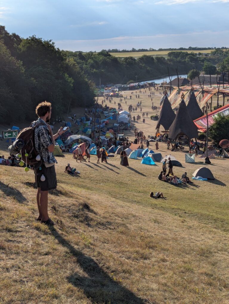 Person using a Buddycompass festival tracker at a music festival.