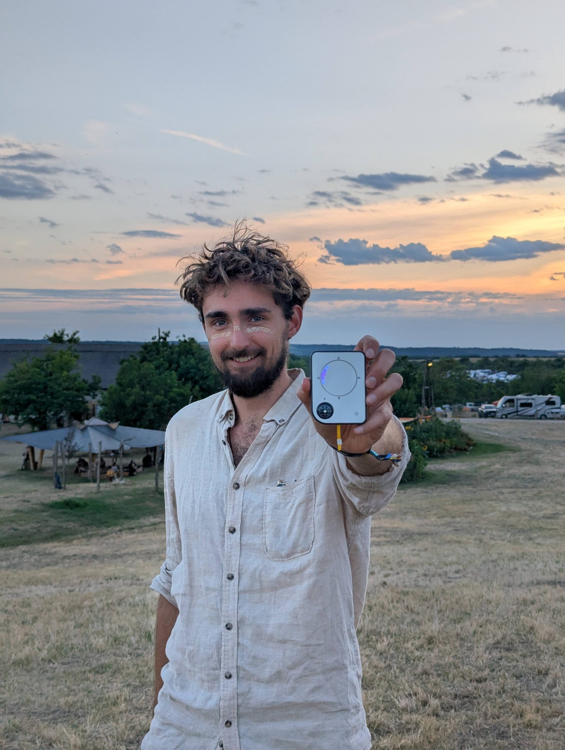 Person using a Buddycompass festival tracker at a music festival.