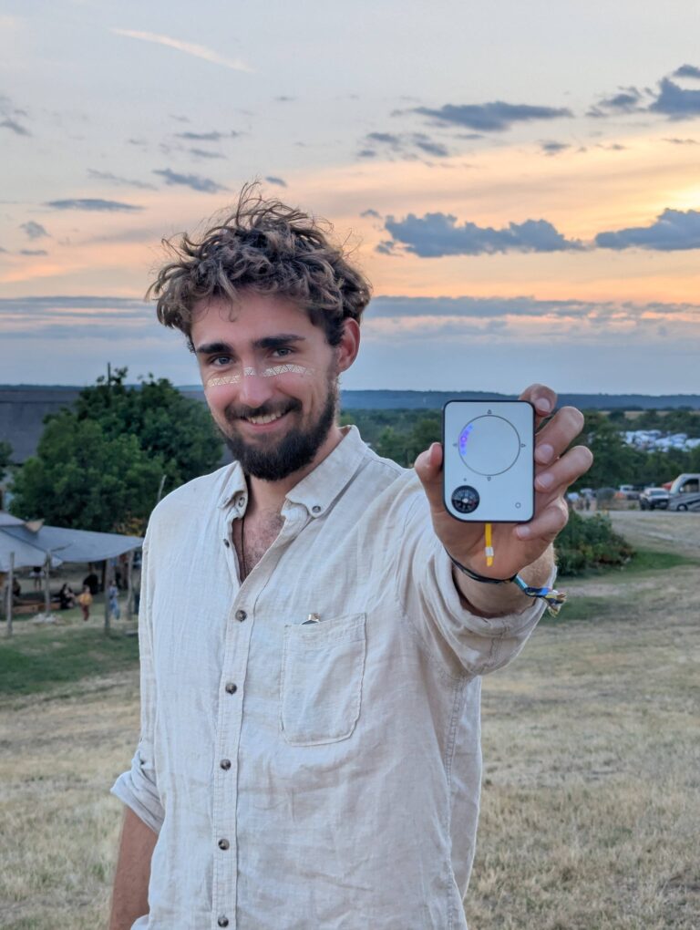 Person using a Buddycompass festival tracker at a music festival.