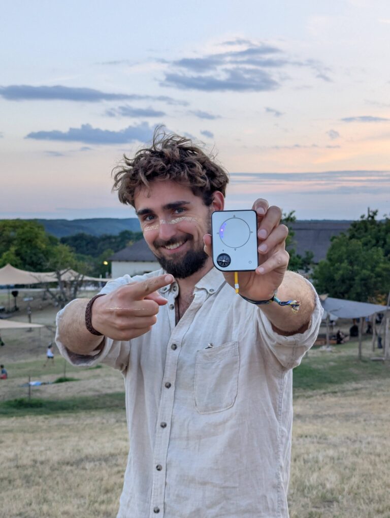 Person using a Buddycompass festival tracker at a music festival.