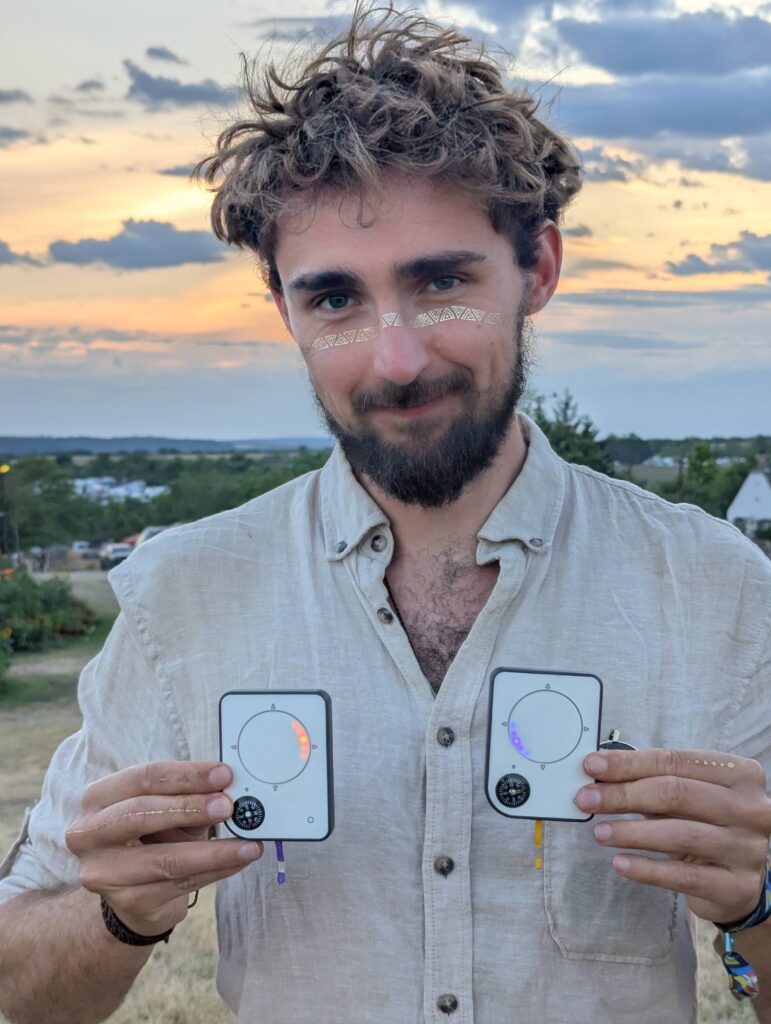 Person using a Buddycompass festival tracker at a music festival.