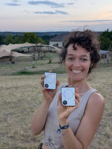 Person using a Buddycompass festival tracker at a music festival.