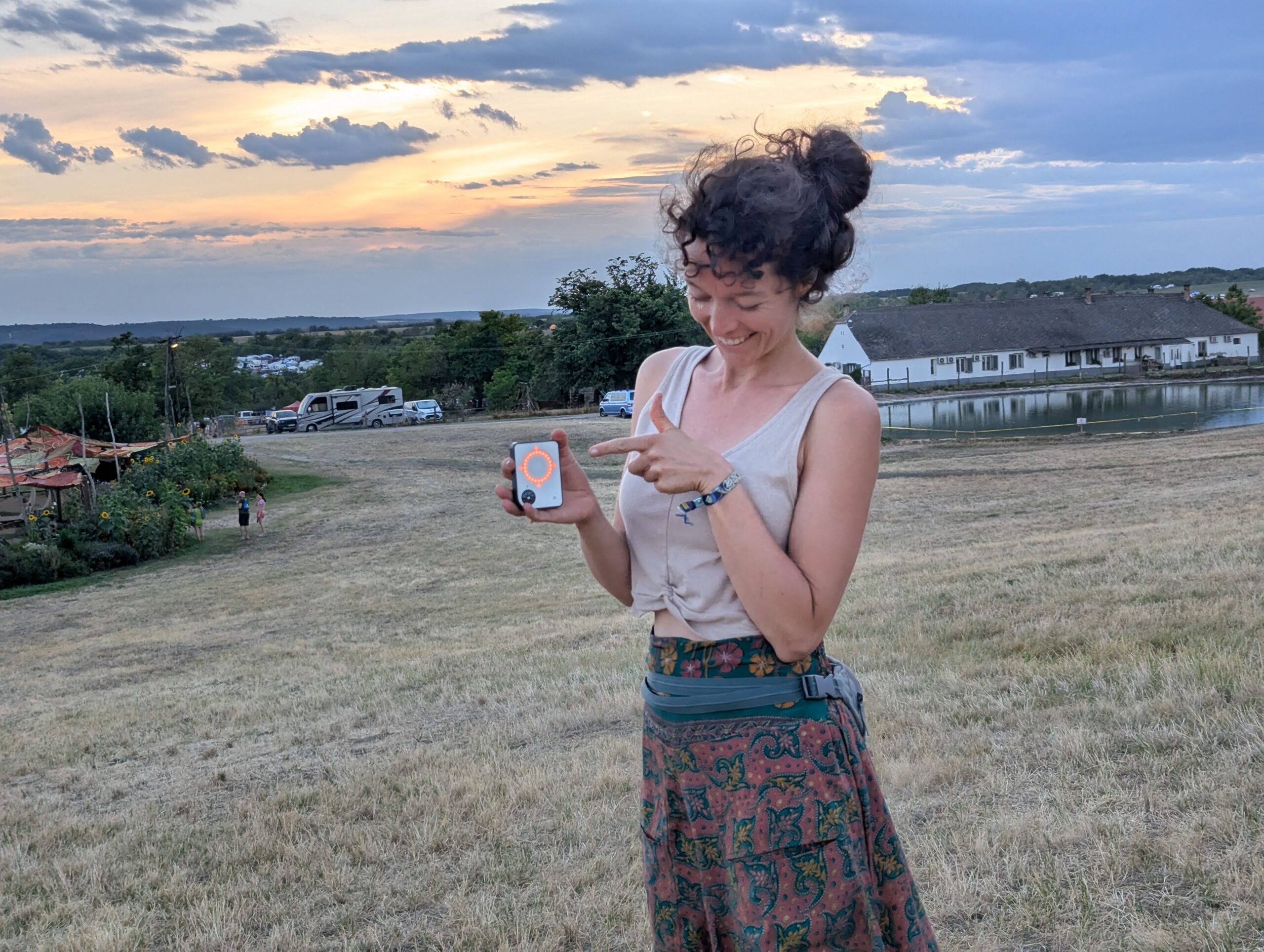 Person using a Buddycompass festival tracker at a music festival.