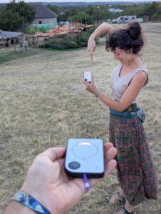 Person using a Buddycompass festival tracker at a music festival.