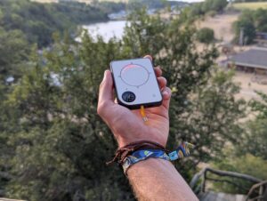 Person using a Buddycompass festival tracker at a music festival.