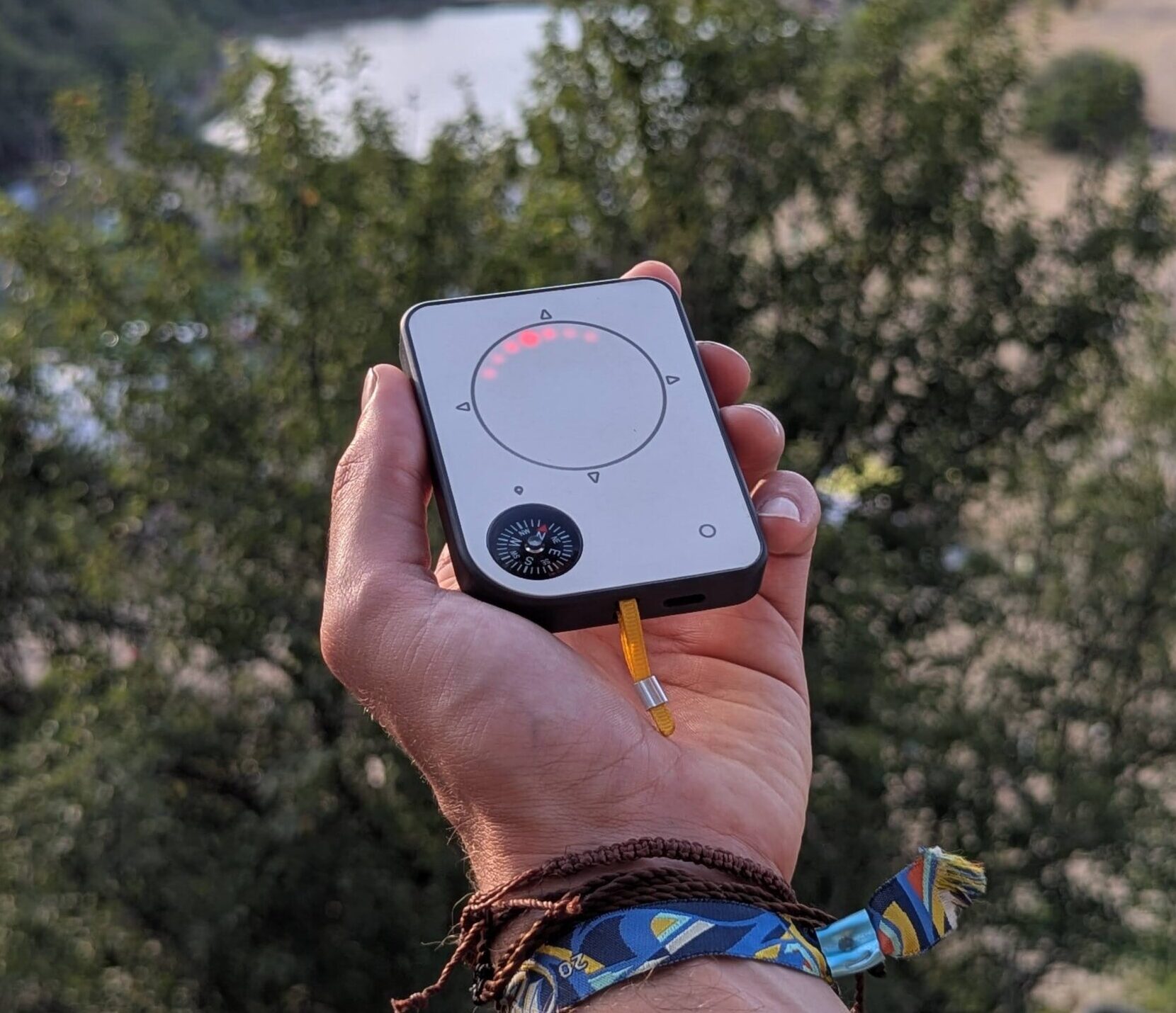 Person using a Buddycompass festival tracker at a music festival.
