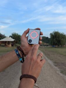 Person using a Buddycompass festival tracker at a music festival.