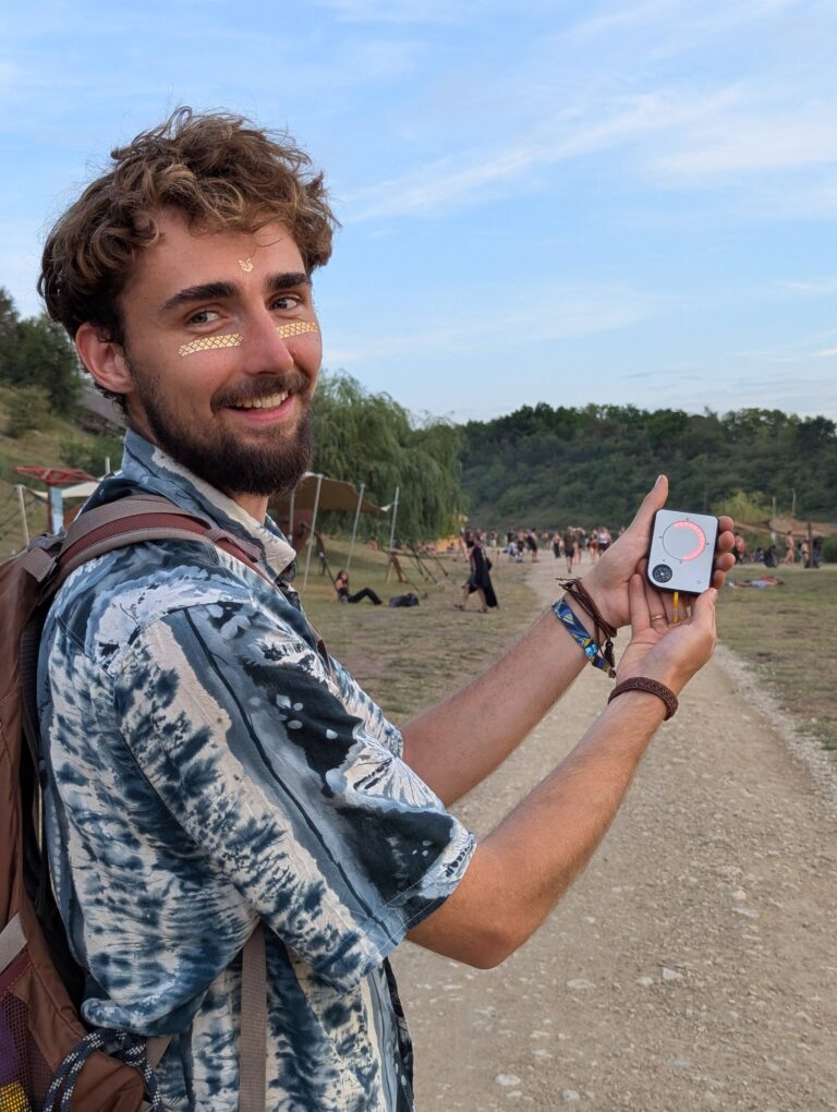 Person using a Buddycompass festival tracker at a music festival.